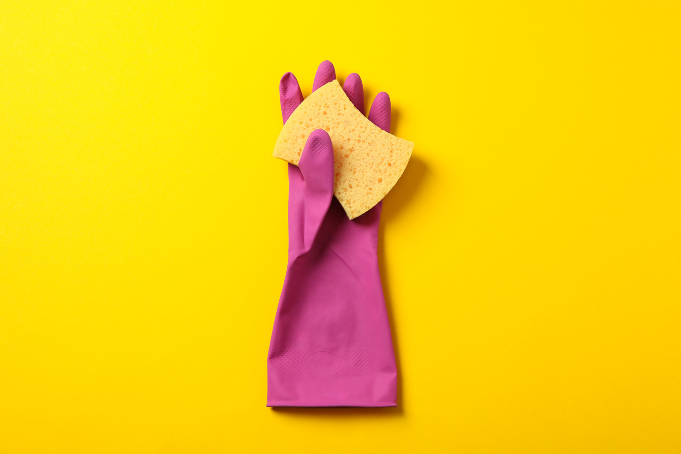 Cleaning Glove and Sponge on Yellow Background, Space for Text